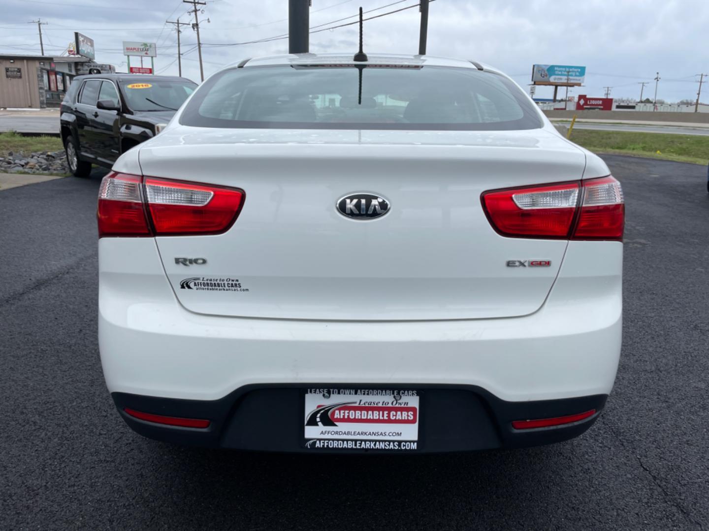 2014 White Kia Rio (KNADN4A35E6) with an 4-Cyl, 1.6 Liter engine, Automatic, 6-Spd transmission, located at 8008 Warden Rd, Sherwood, AR, 72120, (501) 801-6100, 34.830078, -92.186684 - Photo#6